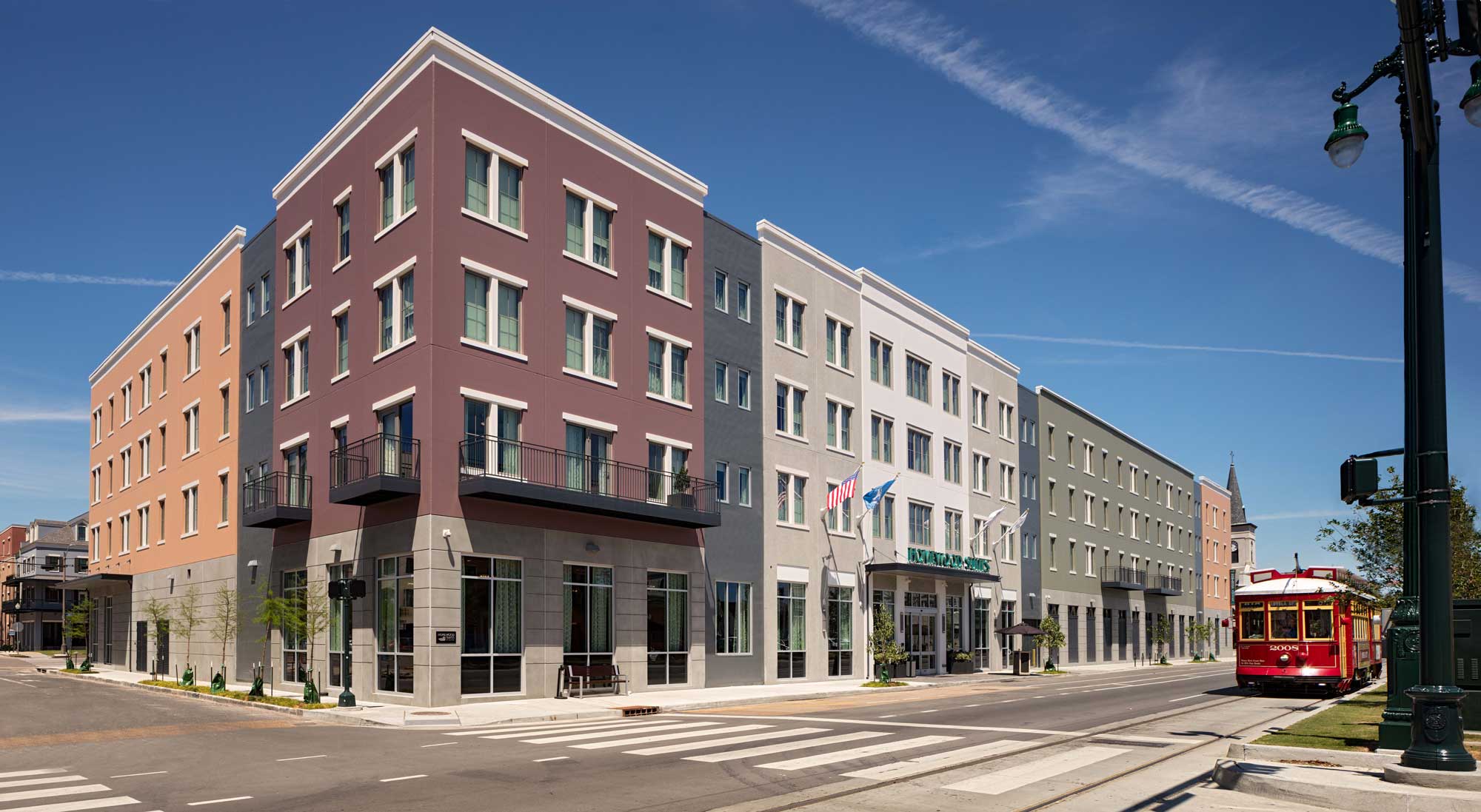 Exterior building during the daylight with train in background