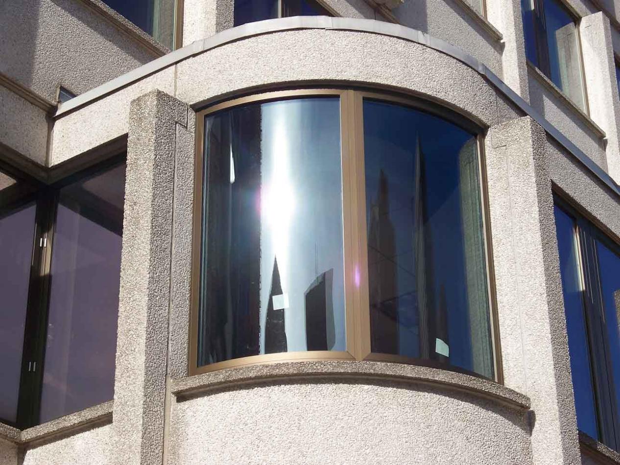 Boston's iconic JFK Federal Building using Winco's custom high performance pre-glazed 1150 fixed and bent corner system integrates historic design with security technology