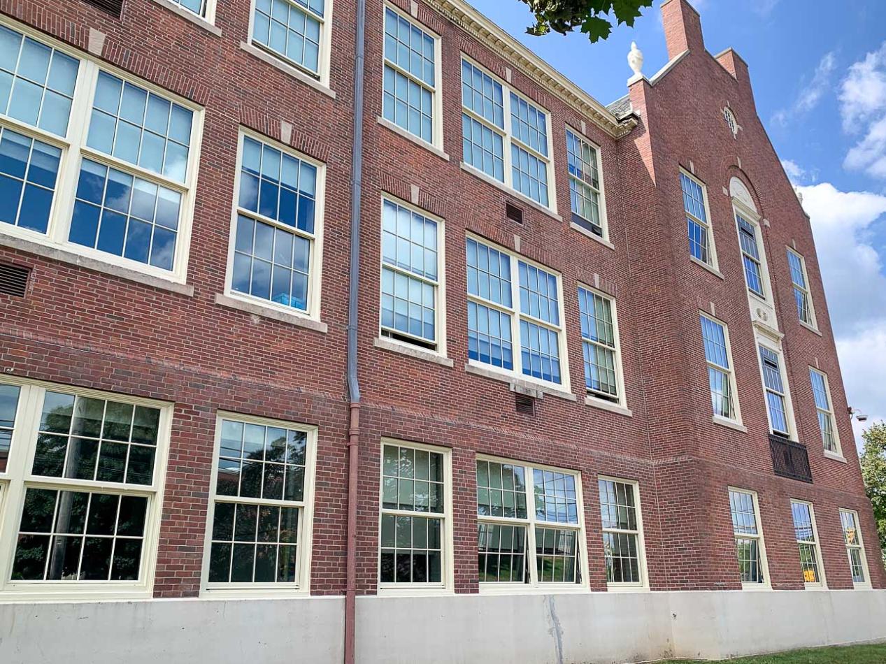 Exterior brick building with historic replica windows