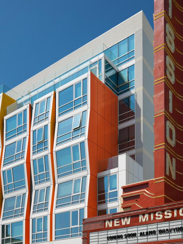 Large colorful facade of Vida Condos featuring multiple windows with zero sightline vents for ventilation and views of the streetscape.