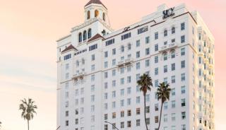 Exterior of white building-with palm trees